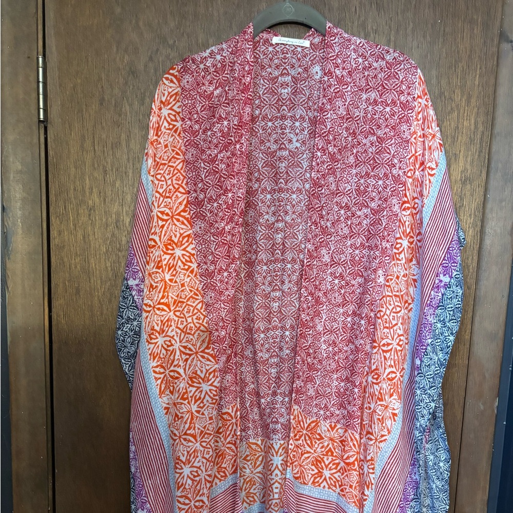 Swim coverup. Multi color. Can also be worn as a layering top.